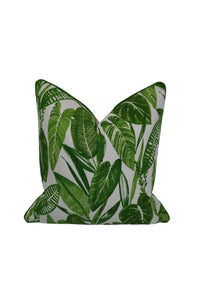 Green leaf-patterned pillow on a white 
background