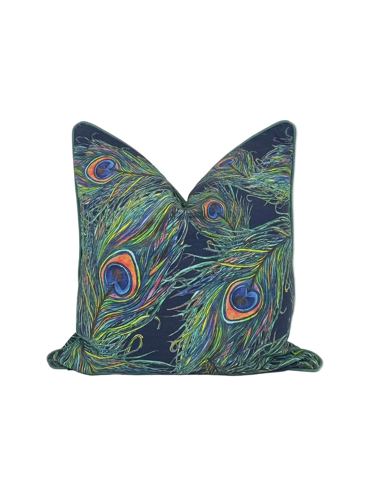A square decorative throw pillow featuring a vibrant peacock feather print on a dark navy blue background, set against a plain white studio backdrop.
