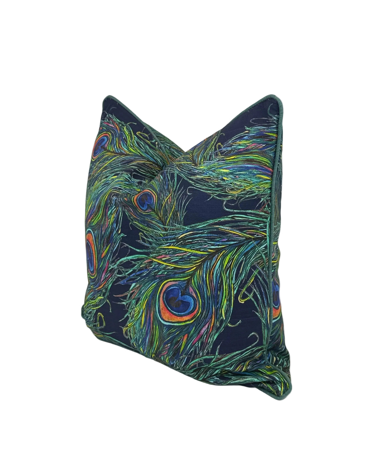 A square decorative throw pillow featuring a vibrant peacock feather print on a dark navy blue background, photographed against a white studio backdrop.