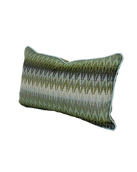 A rectangular lumbar throw pillow with a textured, woven chevron pattern in shades of olive green, and blues, finished with a light blue piped edge, shown on a white background. Finished in a light blue trim.