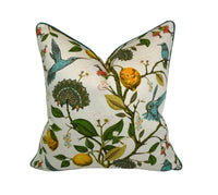 Decorative pillow with a teal hummingbird and floral pattern on a lemon tree on an Ivory-beige background
