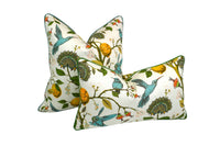 Decorative pillow with a teal hummingbird and floral pattern on a lemon tree on an Ivory-beige background 