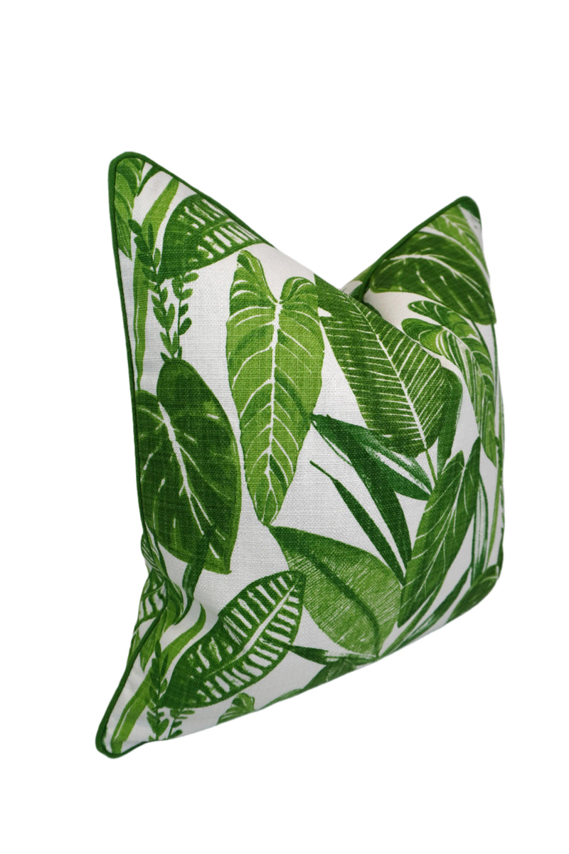 Green leaf-patterned pillow on a white background