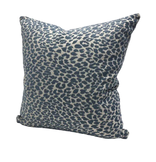 Blue leopard print pillow on a cream background