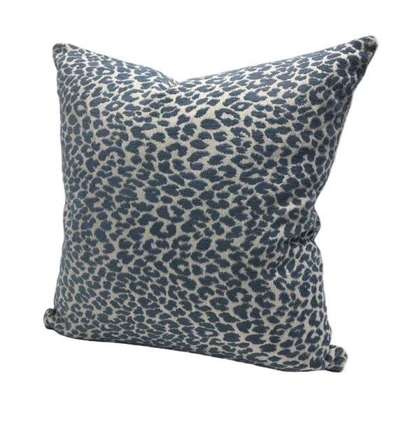 Blue leopard print pillow on a cream background