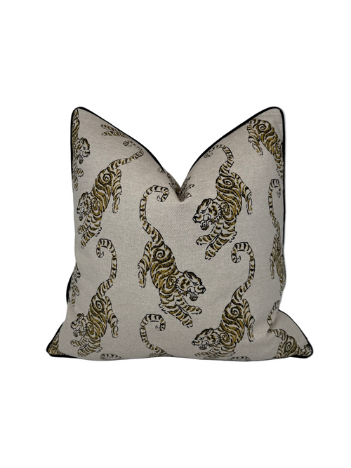 Decorative pillow with tiger pattern on a beige background