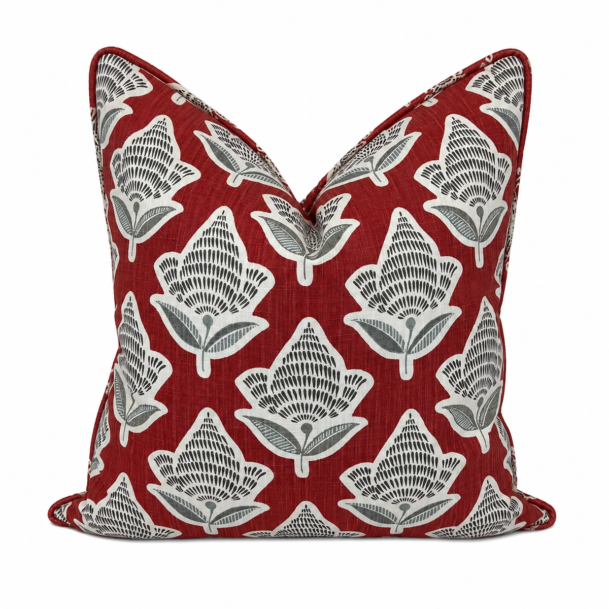 Decorative pillow with leaf pattern on a red background